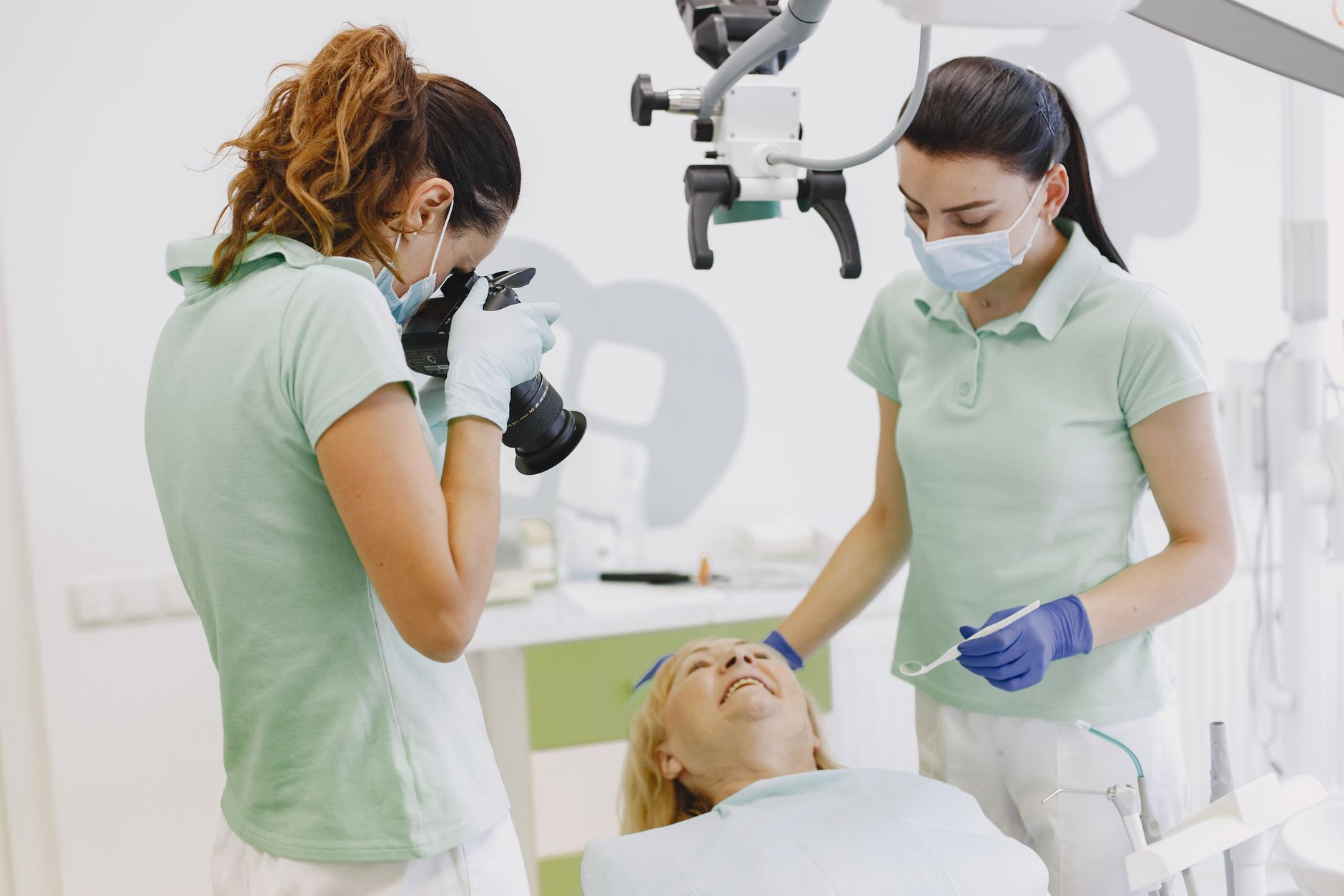 Dental team working together with a patient